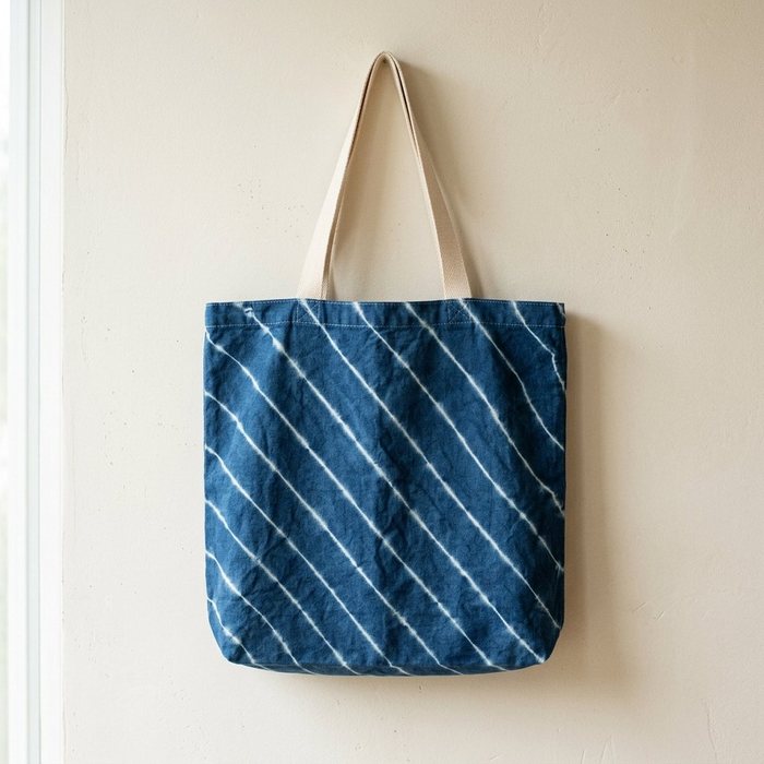Indigo tote bag patterned with fine diagonal white striping